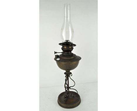 An early 20th century brass oil lamp by Veritas, with original glass funnel, 68cm high