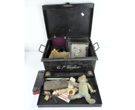 A metal strong box containing a selection of sundries, including a Staunton style chess set, Mabie Todd fountain pen, teddy b