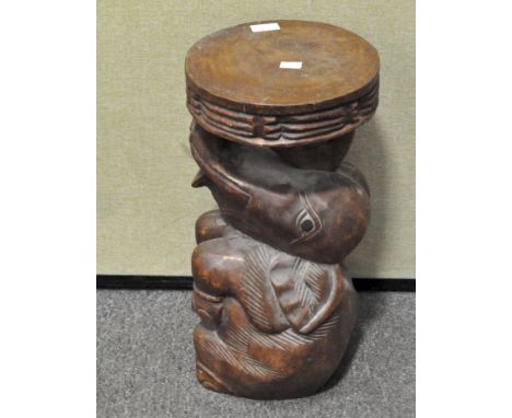 A carved wood elephant stool, 20th century, with circular top, 51.5 cm high