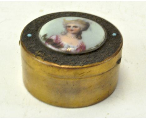 A French circular gilt brass box inset with a portrait of a beauty painted on porcelain, 6 cm diameter 