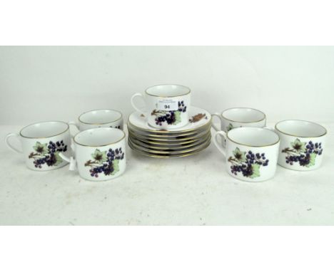 A Royal Worcester 'Evesham' pattern six piece coffee set, comprising coffee cups and saucers (one cup AF)