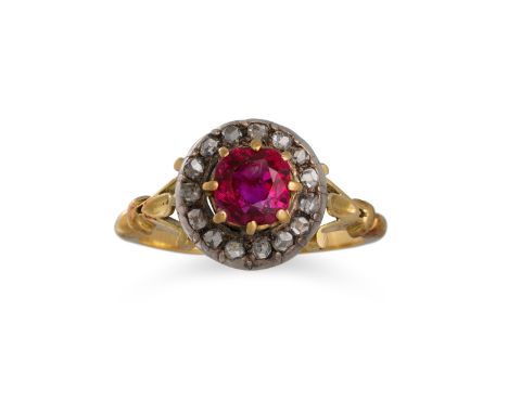 AN ANTIQUE RUBY AND DIAMOND CLUSTER RING, the central ruby to old cut diamond surround, mounted in yellow gold. Estimated: we