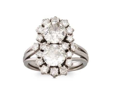 A VINTAGE DIAMOND CLUSTER RING,set with two old cut diamonds to a diamond surround, mounted in gold. Estimated: weight of dia