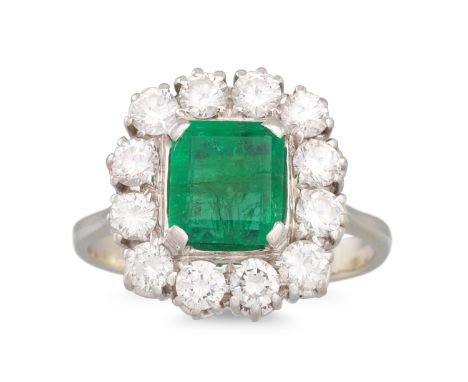 AN EMERALD AND DIAMOND CLUSTER RING, mounted in 18ct white gold. Estimated: weight of diamonds: 1.00 ct. emerald: 1.00 ct siz