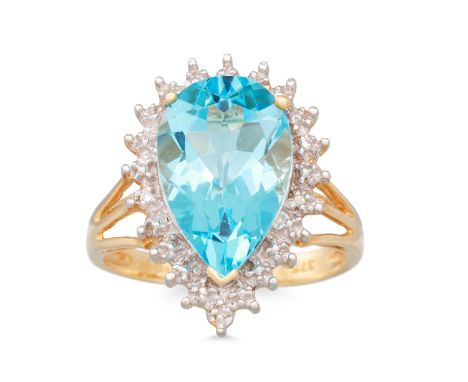 A TOPAZ RING, the pear shaped blue topaz to diamond chip surround, mounted in 9ct yellow gold, size K - L