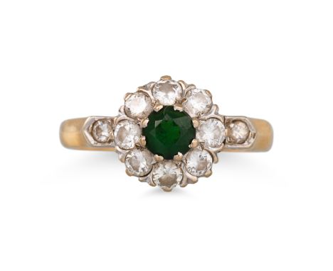 A GREEN TOURMALINE AND DIAMOND RING, mounted in 18ct yellow gold. Estimated: weight of diamonds: 0.75 ct. size M ***Hallmarke