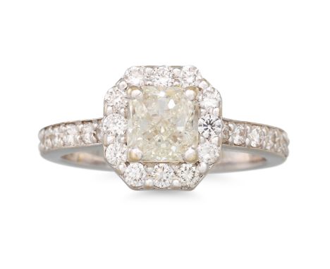 A DIAMOND SOLITAIRE RING, the central diamond to a diamond surround shoulders, mounted in 18ct yellow gold. Together with an 