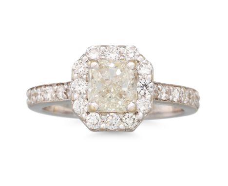 A DIAMOND SOLITAIRE RING, the central diamond to a diamond surround shoulders, mounted in 18ct yellow gold. Together with an 