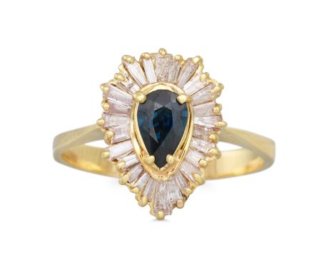 A DIAMOND AND SAPPHIRE CLUSTER RING, the pear shaped sapphire to a baguette cut diamond ballerina style surround, mounted in 