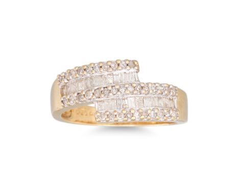 A DIAMOND CROSSOVER RING, mounted in 9ct yellow gold. Estimated: weight of diamonds: 0.50 ct. size M