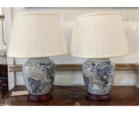 TABLE LAMPS, a pair, Chinese export style blue and white ceramic, each 51cm tall with shades. (2) 