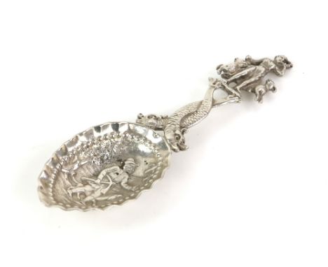 Continental silver hunting theme caddy spoon the bowl decorated with a man carrying a cross bow and with a dog, a serpent for