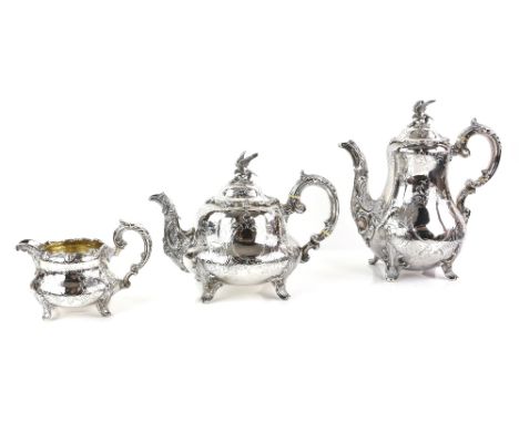 Victorian silver three piece tea service, comprising tea pot, hot water jug and cream jug, with engraved and moulded scrollin