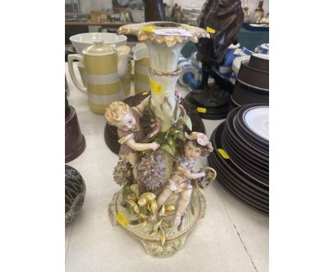 A Meissen candlestick with figures, a.f