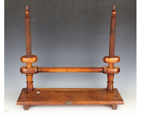 An early 20th century elm and fruitwood bookmaker's press by O. Friedheim, width 66cm, together with a tapestry frame.Buyer’s