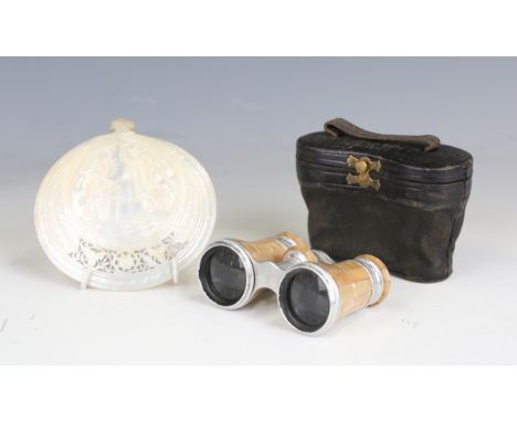 A pair of early 20th century French mother-of-pearl opera glasses by 'Le Maire', cased, and a carved abalone shell, titled 'B