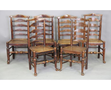 A set of six late 18th/early 19th century ash and elm shaped ladder back kitchen chairs with recessed panel seats, on turned 