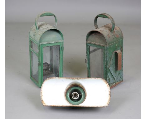 A pair of British Railways hand lamps, one fitted with original burner, height 52cm, together with a green enamelled station 