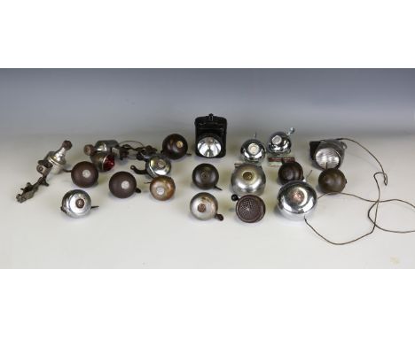 A collection of vintage bicycle parts, including lights, pumps, bells, bulbs, inner tubes and related items.Buyer’s Premium 2