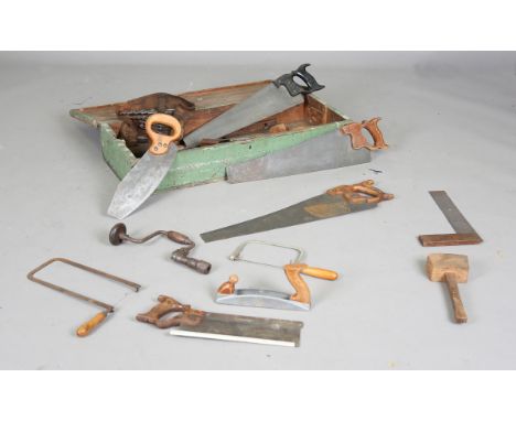 An early 20th century green painted toolbox, containing a quantity of various tools, width of box 89cm.Buyer’s Premium 29.4% 