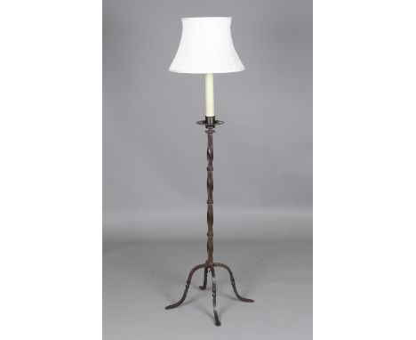 A 20th century patinated wrought iron lamp standard, the wrythen stem on four scrolled legs, height 112cm.Buyer’s Premium 29.