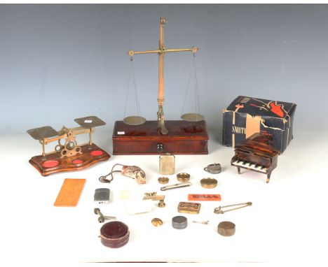 A set of late 19th century mahogany and brass balance scales by Edward Hely &amp; Co, Dublin, height 35cm, a carved and paint