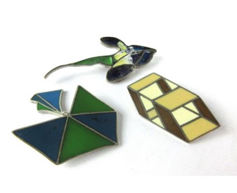 Three silver and enamelled brooches, one in the form of an orchid, the other two of geometric design, all hallmarked for 'EK'