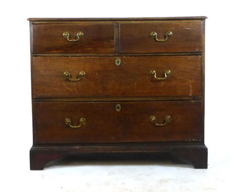 A mid 18th century oak chest of two short over two long drawers on bracket feet. h. 90 cm, w. 105 cm, d.55 cm   CONDITION REP