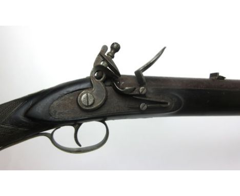 A 19th century Baker rifle style eighteen bore flintlock carbine rife, with brass fittings, brass tipped metal ram rod, foldi