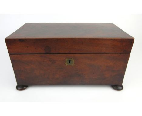 A Regency mahogany tea caddy with two tea compartments and later mixing bowl on squat bun feet, h. 15.5 cm, w. 35 cm, d. 16 c