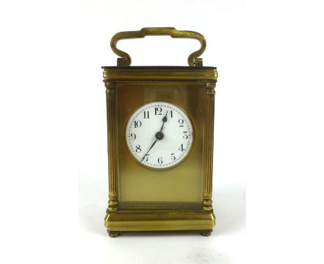 A brass cased five glass carriage clock, the enamelled face with Arabic numerals. h. 14 cm, w. 7.5 cm, d. 6 cm   CONDITION RE