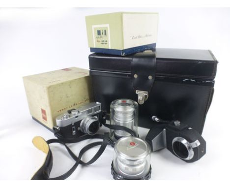A Leica M4 DBP camera body serial No. 1180 476, together with three Leitz lenses (Elmar 1:2.8/50, Elmar 1:35/65, and Elmarit 