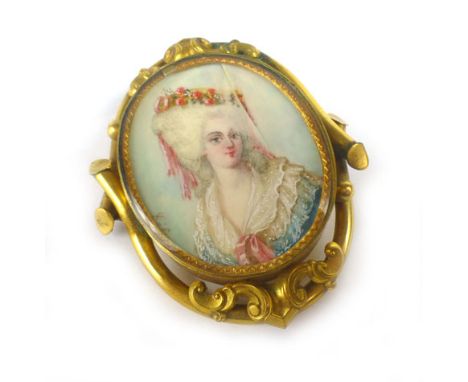 A 19th century yellow metal brooch of oval form centrally set with a miniature portrait on ivory depicting an 18th century fe