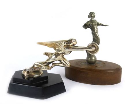 A mid 20th century Packard car mascot of chrome plated winged figure, fixed on a black wooden base, together with another car