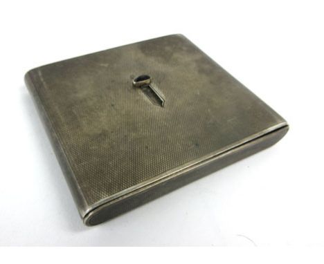 A silver engine turned cigarette case of rectangular form having a hinged action, maker mark indistinct, Birmingham 1931, w. 