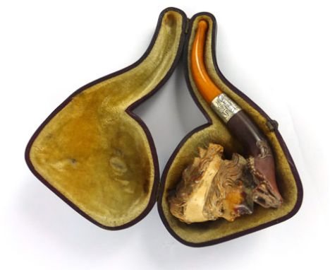 A 19th century smokers pipe, with hallmarked silver collar and an amber mouthpiece, in original leather case 