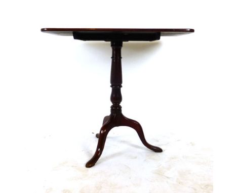 A Georgian mahogany rectangular topped tilt top table tripod table, on turned column and three splay legs. h. 72 cm, w. 76 cm