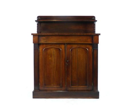 A Regency rosewood chiffonier the super structure on barley twist supports above single drawer over two cupboard doors. h. 12