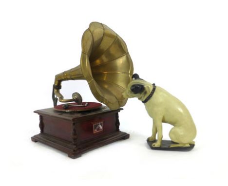 A mid 20th century "His Masters Voice" gramophone player with brass trumpet along with a plastic model of the dog. h. 60 cm, 