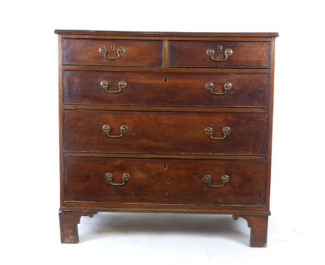 A late 18th century oak chest of two short over three long drawers on shaped bracket feet. h. 94 cm, w. 96 cm, d. 52 cm   CON