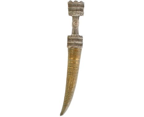 A 19TH CENTURY TURKISH JAMBIYA, 25cm curved patinated blade, characteristic white metal mounted wooden hilt decorated with fi