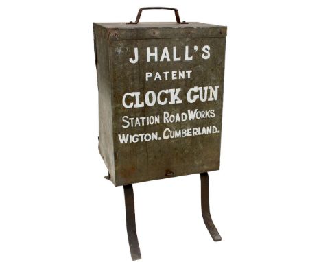 A HALL'S PATENT CLOCK GUN, the galvanised case with repainted patent details and address, the interior complete with paper in