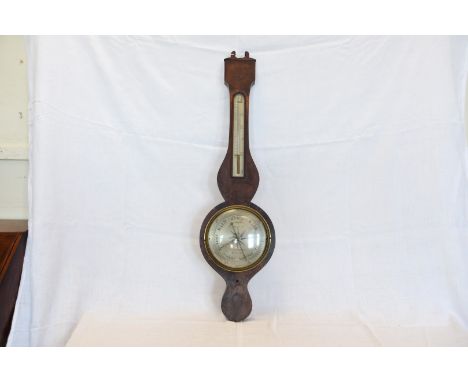 A 19th century walnut cased barometer/thermometer.  The 8ins dial engraved R Squirrell Stowmarket.  Est £30-50