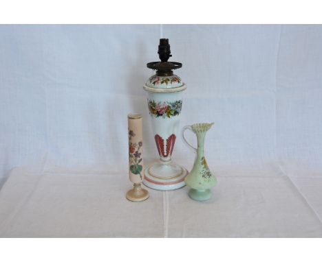 A glass oil lamp with painted floral decoration, a painted glass spill vase and a painted glass viewer with floral decoration