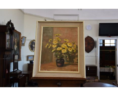 B C Lilley, an oil on board still life study of a vase of flowers.  15¼ by 9¼ins.  In a hessian mounted white painted frame, 