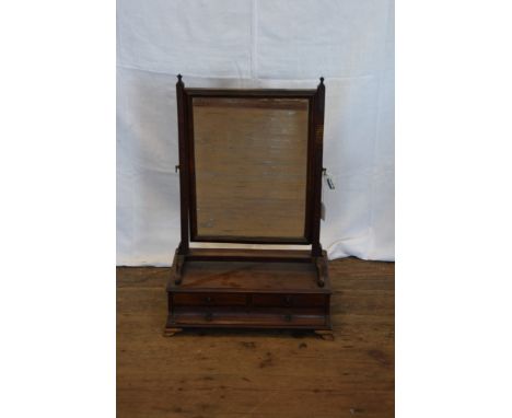 An 18th century mahogany dressing table mirror with rectangular plate above a down-swept base with two short and one long dra