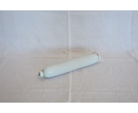 A milk glass rolling pin.  Est £10-20