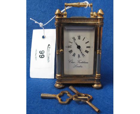 Small brass carriage clock with full depth Roman numeral enamel face marked: Charles Frodsham, London, with key.(B.P. 24% inc