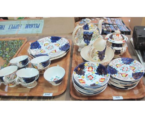 Two trays of 19th Century Gaudy Welsh 'Tulip' design teaware comprising: teapot; sucrier; milk jug; cups; saucers; plates etc