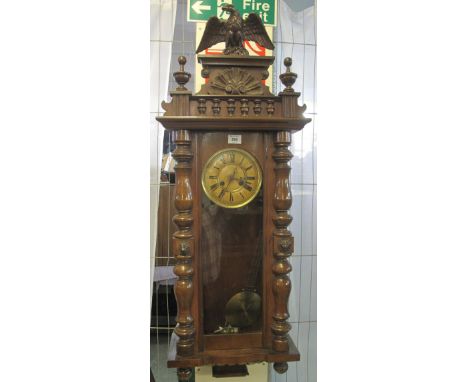 Early 20th Century two train Vienna type wall clock with key and pendulum and eagle pediment.(B.P. 24% incl. VAT)   CONDITION